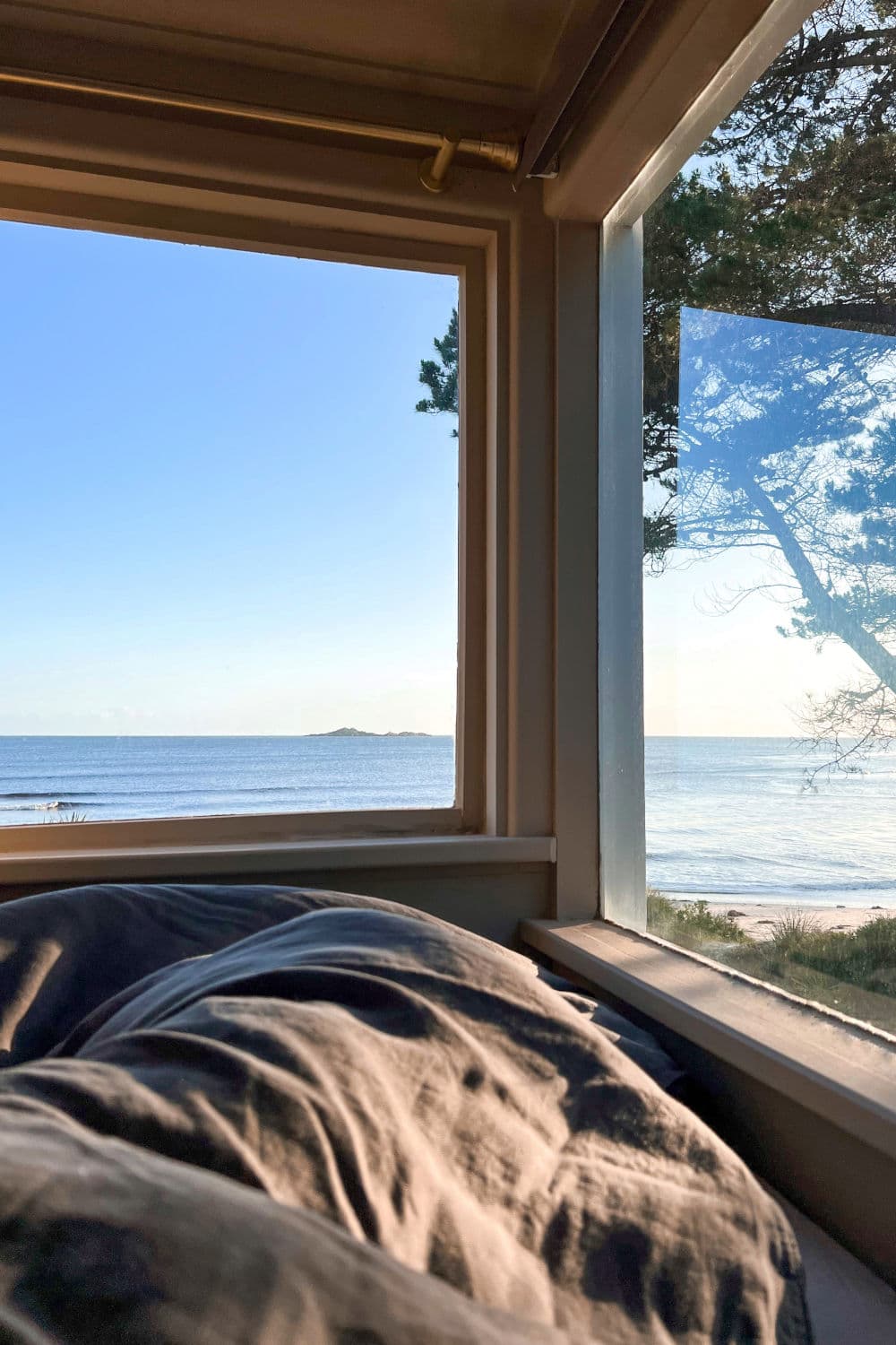 Lying in bed looking out over the ocean