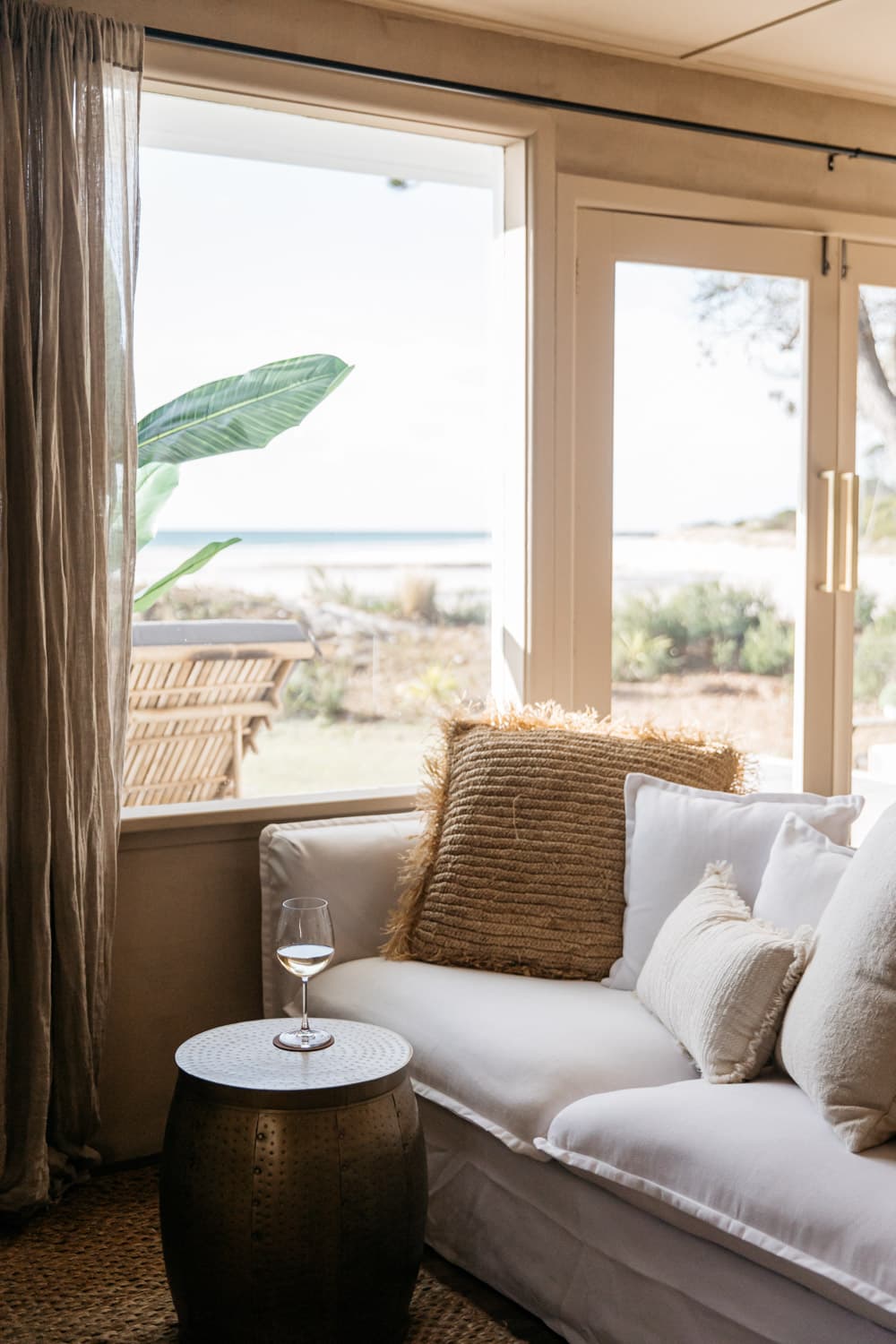 Couch with wine on side table