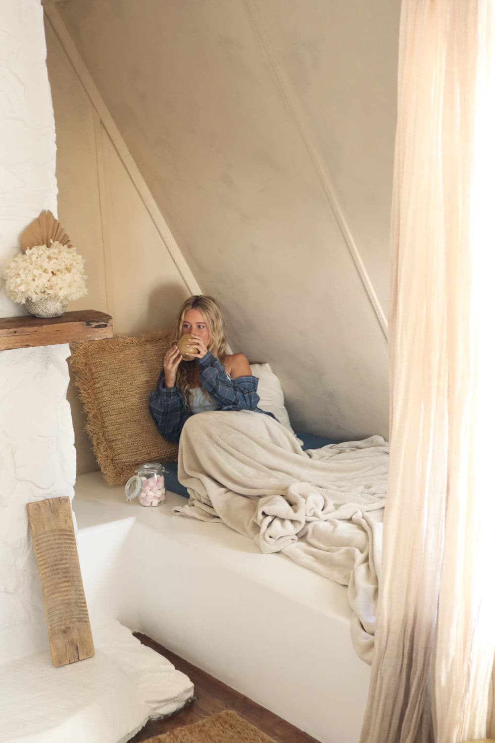 Woman drinking in seating nook