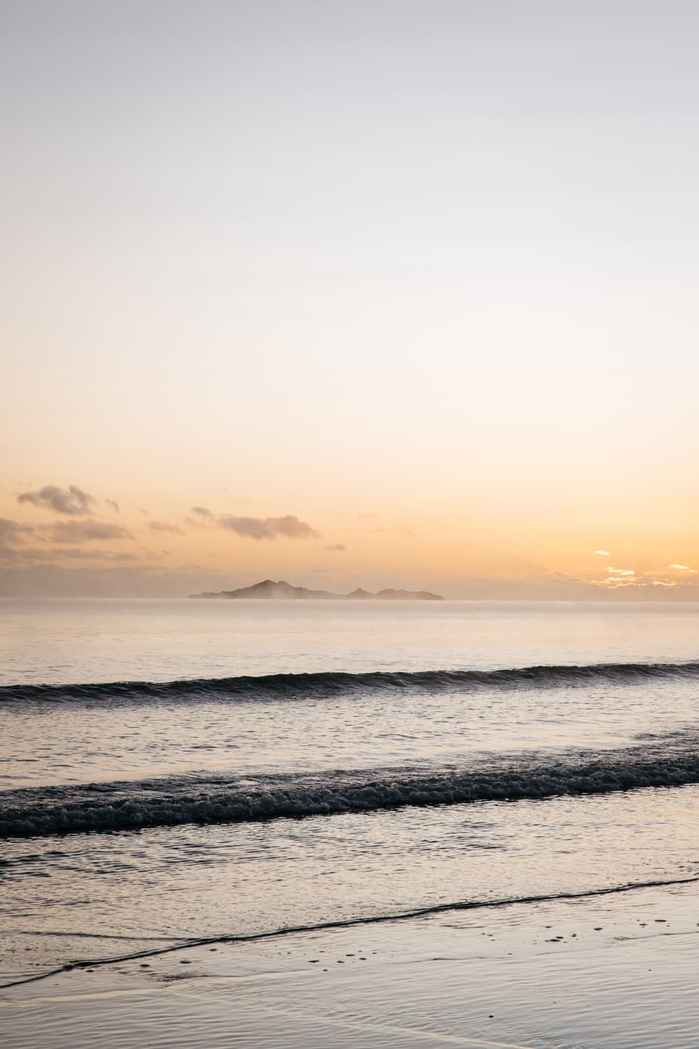 Sunrise behind clouds overlooking Sisters Island