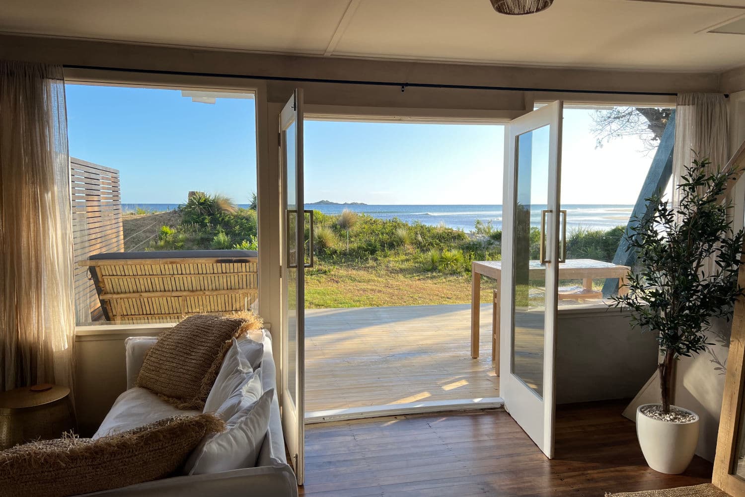 View from living area of deck, garden and ocean